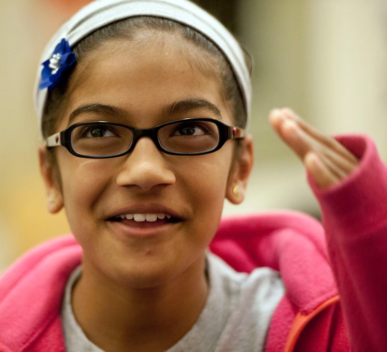 Scripps National Spelling Bee contestant Vanya Shivashankar, 11, of Olathe, Kansas talks about her experience taking the Preliminaries Test during the first round of the contest in Oxon Hill, Md., Tuesday, May 28, 2013. Shivashankar's older sister Kavya Shivashankar won the Bee in 2009. The 86th edition of the Scripps National Spelling Bee took on new meaning Tuesday _ or rather, lots of meanings _ with organizers having decreed that the precocious youngsters need to prove they know the definitions of some of those tough words. The 281 competitors took a 45-minute computer test that probed their knowledge of spelling and vocabulary, with the results to be combined with Wednesday's on-stage round to determine which spellers advance to the semifinals Thursday. (AP Photo/Cliff Owen)