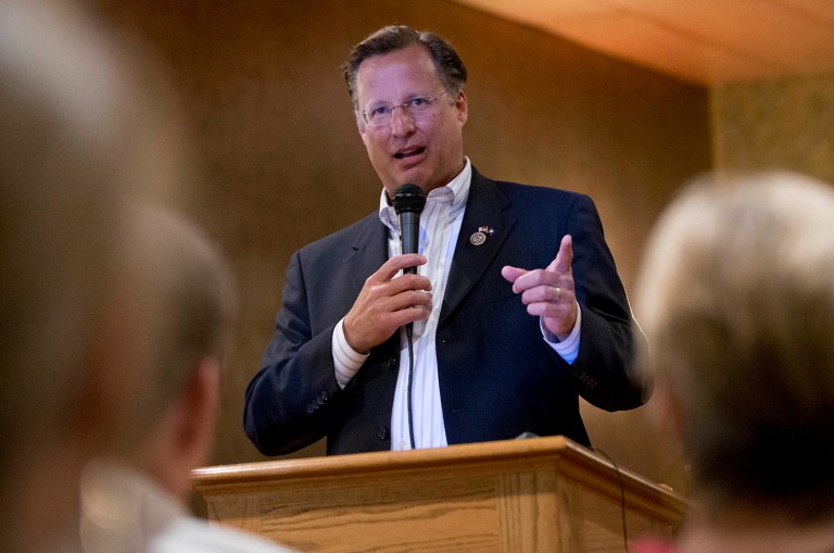 Congressman Dave Brat, R-Va., answers a question during a town hall meeting with the congressman in Blackstone, Va., Tuesday, Feb. 21, 2017. (AP Photo/Steve Helber)