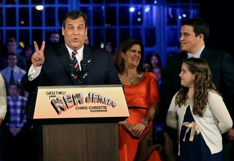 Republican New Jersey Gov. Chris Christie signals second term as he stands with his wife, Mary Pat Christie, second right, and their children, Andrew, back right, Bridget, right, as they celebrate his election victory in Asbury Park, N.J., Tuesday, Nov. 5, 2013, after defeating Democratic challenger Barbara Buono. (AP Photo/Mel Evans)