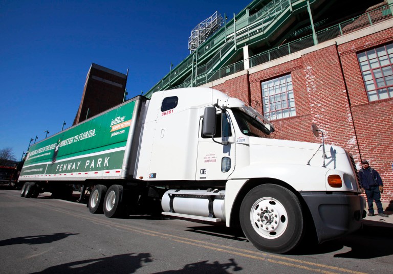 The big-rig truck rules establish standards to improve fuel efficiency and reduce greenhouse gas emissions. (AP Photo/Steven Senne)