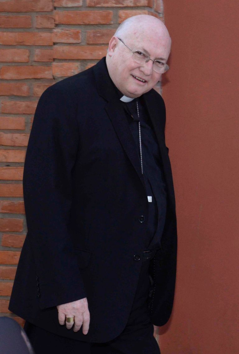In this July 25, 2014 photo, Bishop Rogelio Ricardo Livieres Plano walks to church in Ciudad del Este, Paraguay. Livieres Plano, a member of the conservative Opus Dei movement, has been removed by Pope Francis from a Paraguayan diocese said the Vatican Thursday, Sept. 25, 2014, after he clashed with his fellow bishops by opening his own seminary and promoting an Argentine priest accused of inappropriate sexual behavior. (AP Photo/ABC, Raul Gonzalez)