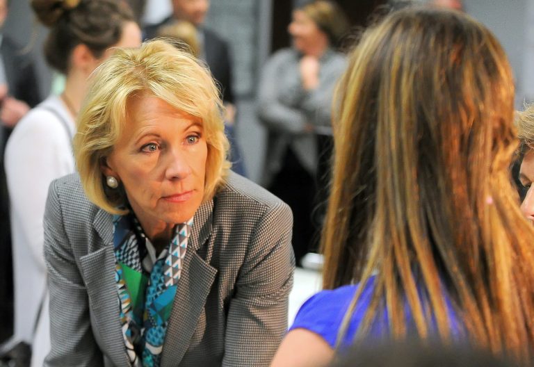 Education Secretary Betsy DeVos, left, talks to Alaina Arney during a visit to the Van Wert Robotics Club at Van Wert High School on April 20 in Van Wert, Ohio. American Federation of Teachers President Randi Weingarten joined DeVos during the visit. (Richard Parrish/The Lima News via AP)