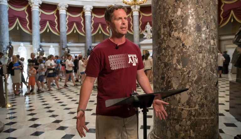 Rep. Rodney Davis, R-Ill., still wearing his baseball uniform, describes the scene during a shooting at a congressional baseball game in Alexandria, Va., where House Majority Whip Steve Scalise and others were shot. (AP Photo/J. Scott Applewhite)