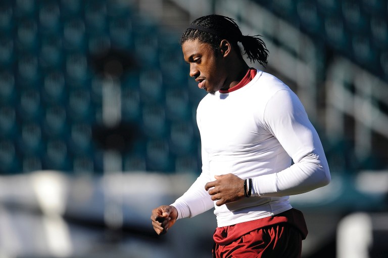 Patrick McDermott/Getty Images
Quarterback Robert Griffin III can't practice with teammates yet but is working on verbalizing calls and visualizing plays.
