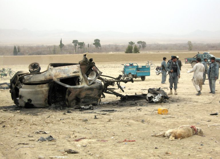 Getty ImagesAfghans stand at the site of a blast on February 27, 2011 in Arghandab district of Kandahar province, Afghanistan.  Eight Afghan civilians were killed when two blasts targeted a dog fighting competetion, a practice that was previously banned under Taliban rule.