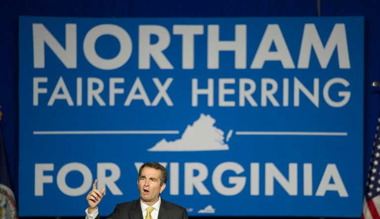On Nov. 7, 2017, Democrats won big in state and local contests, flipping executive offices and legislative seats in white, upscale suburbs near Philadelphia, New York, and Washington, D.C., long held by Republicans and crucial to their coalition. Gov.-elect Ralph Northam of Virginia was one of these winning Democratic candidates. (AP Photo/Cliff Owen)