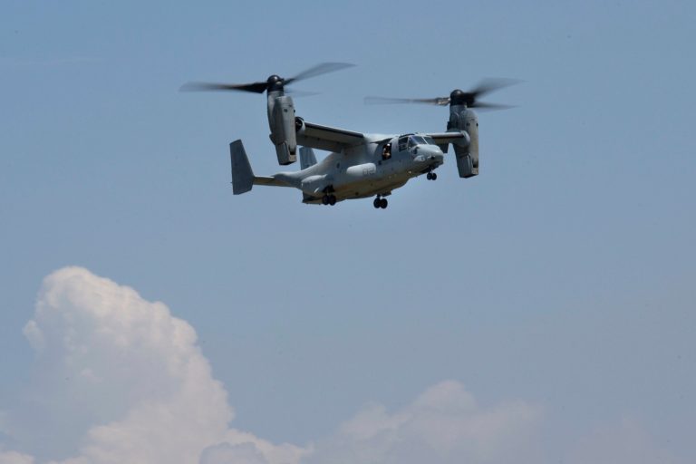A U.S. Osprey flies back to Tribhuvan International airport in Kathmandu, Nepal, Thursday, May 14, 2015. A search continued Thursday for a U.S. Marine helicopter carrying six Marines and two Nepalese soldiers. It disappeared Tuesday while delivering aid in the country's northeast. (AP Photo/Bernat Amangue)