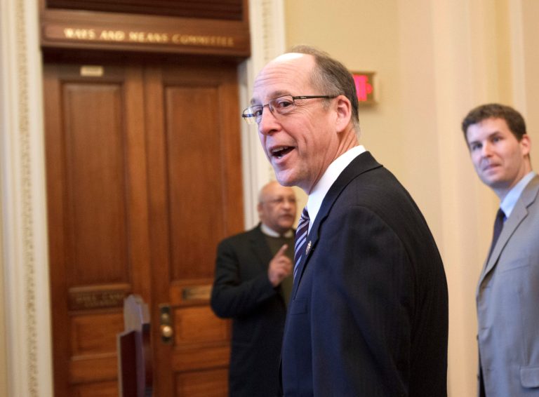 Rep. Greg Walden, R-Ore., smiles as he heads to the House Ways and Means Committee room on Capitol Hill in Washington in 2012. (AP Photo/J. Scott Applewhite)