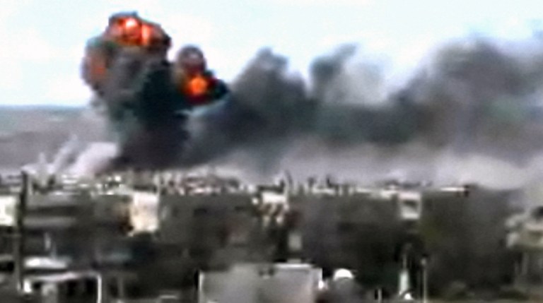   This video image taken from amateur video and broadcast by Bambuser/Homslive shows a series of devastating explosions rocking the central Syrian city of Homs, Syria, Monday, June 11, 2012. Live streaming video caught the devastation during one of the heaviest examples of violence since the uprisings began over a year ago. (Photo/Bambuser/Homslive via AP video) MANDATORY CREDIT: BAMBUSER/HOMSLIVE  