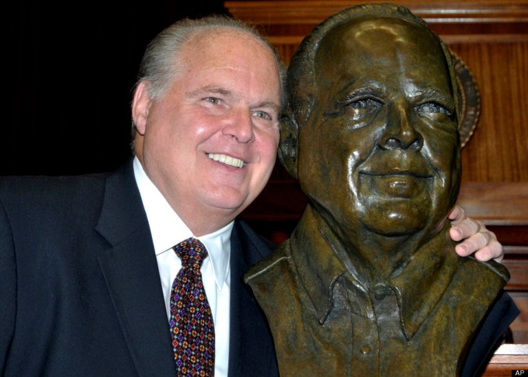 Conservative commentator Rush Limbaugh poses with a bust in his likeness during a secretive ceremony inducting him into the Hall of Famous Missourians on Monday, May 14, 2012, in the state Capitol in Jefferson City, Mo. (AP Photo/Julie Smith)
