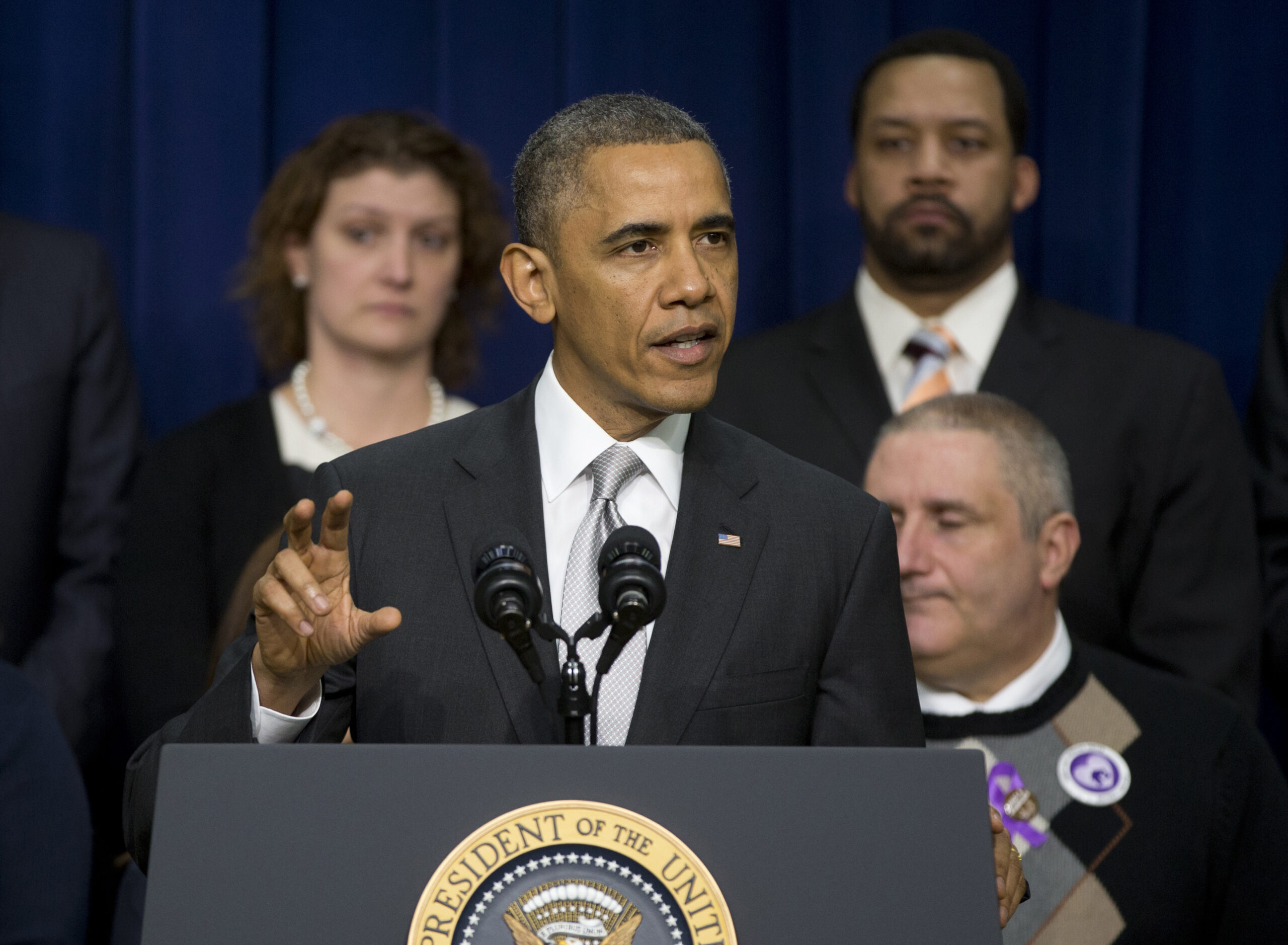 Obama declares health care law is working