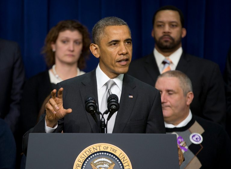 President Barack Obama speaks about the new health care law, Tuesday, Dec. 3, 2013, in the South Court Auditorium in the Eisenhower Executive Office Building on the White House complex in Washington. The President argued that his health law is preventing insurance discrimination against those with pre-existing conditions and is allowing young people to stay on their parents' coverage until age 26. On stage with the president are Americans the White House says have gained as a result of the Affordable Care Act.  (AP Photo/Carolyn Kaster)