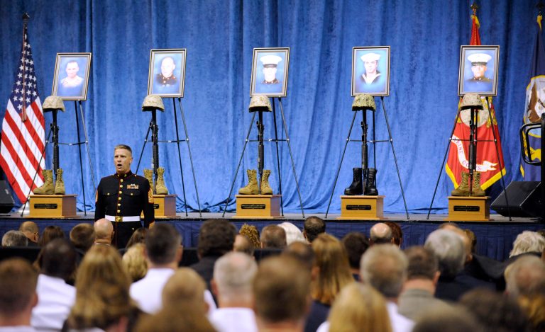 Marine First Sargeant John Coyne announces the names of the fallen Marines and Sailor during Roll Call at a memorial service Saturday, Aug. 15, 2015, in Chattanooga, Tenn. The service was for four Marines and a sailor killed as a result of attacks on a military recruiting station and a Naval operations center July 16 in Chattanooga. (AP Photo/Mark Gilliland)