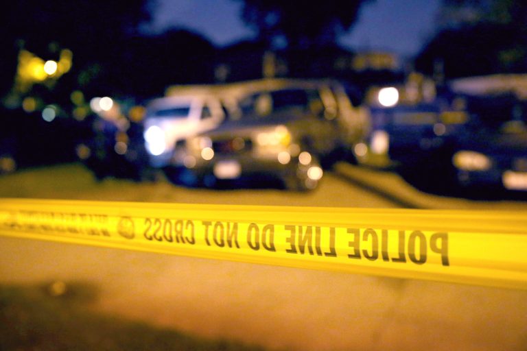 Scott Olson/Getty ImagesPolice collect evidence at the scene of a shooting June 23 in Chicago.