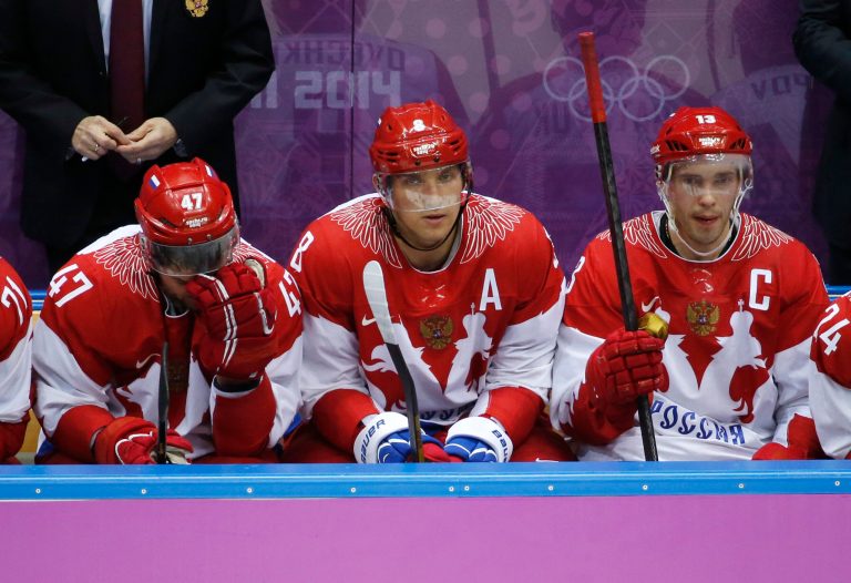 Russia forwards Alexander Radulov, from left, Alexander Ovechkin and Pavel Datsyuk watch play against Finland late in the third period of a men's quarterfinal ice hockey game at the 2014 Winter Olympics, Wednesday, Feb. 19, 2014, in Sochi, Russia. (AP Photo/Mark Humphrey)