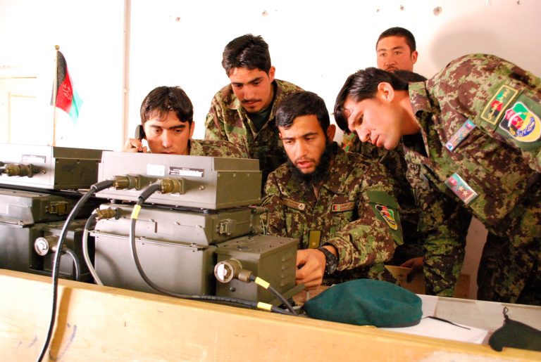 Afghan National Army soldiers in the Shinwar district of Nangarhar Province, Afghanistan, train on their radio on May 18. (AP Photo/Kristin M. Hall)