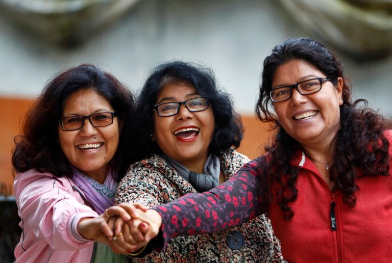 In this March 1, 2014 photo, from left,  Lucky, Dicky, and Nicky Chettri pose for photographs at the 3 Sisters Adventure Trekking Company office in Pokhara, Nepal.  When Lucky, Dicky and Nicky Chettri tried to break into Nepal's male-dominated trekking industry 20 years ago, competitors tried to run them out of business. Men threatened them, harassed them - even filed bogus police reports against them. (AP Photo/Niranjan Shrestha)