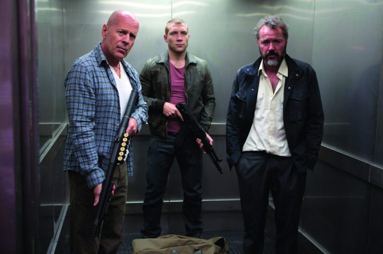FILE - This publicity film image released by 20th Century Fox shows Bruce Willis as John McClane, left, Jai Courtney as his son Jack, center and Sebastian Koch as Komarov in a scene from 