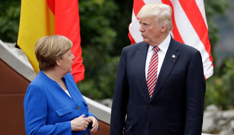 President Donald Trump speaks with German Chancellor Angela Merkel at the G7 Summit in Italy. Trump told European officials that the Germans are 