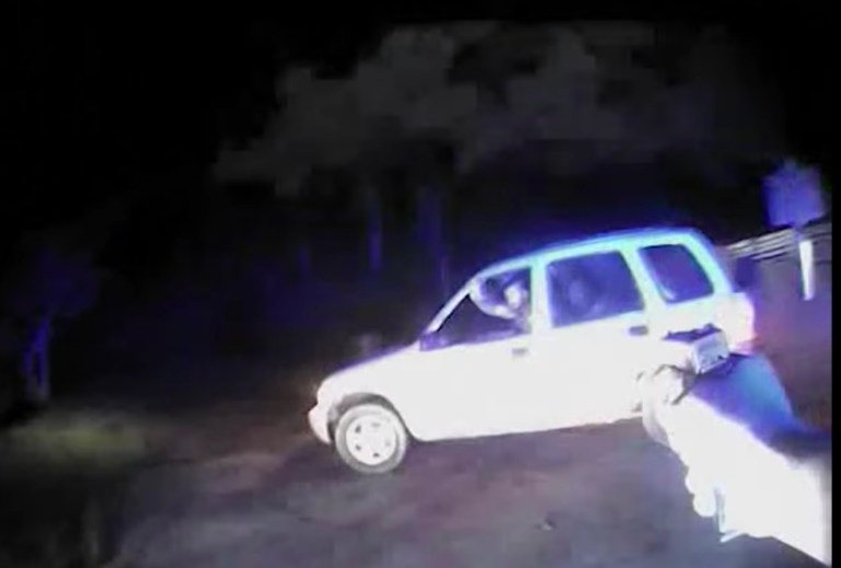 A graphic video captured late last year from a Louisiana police body camera shows officers firing 18 rounds into a car that left a 6-year-old autistic boy dead. (Screenshot)