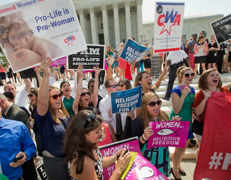 Demonstrators react to hearing the Supreme Court's decision on the Hobby Lobby case outside the Supreme Court building earlier this year. (AP Photo/Pablo Martinez Monsivais)