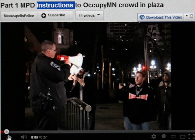   This May 17, 2012, image made of the Minneapolis Police Department YouTube Channel shows a computer screen displaying a video of a Minneapolis police officer giving instructions to protesters at an Occupy Minnesota protest in Minneapolis. Minneapolis police first used their YouTube channel after protesters posted video accusing officers of brutality disrupting a demonstration with no warning to disperse. Police filmed the arrests and soon posted their own video showing warnings were given. (AP Photo/Minneapolis Police Department YouTube Channel)  