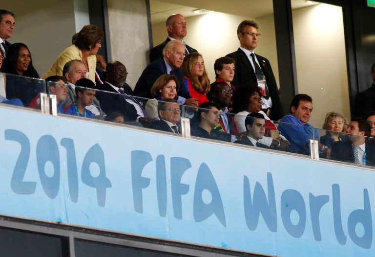 U.S. Vice President Joe Biden, center, watches the group G World Cup soccer match between Ghana and the United States at the Arena das Dunas in Natal, Brazil, Monday, June 16, 2014. (AP Photo/Julio Cortez)