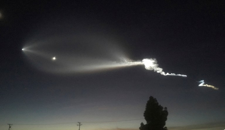 In this photo provided by Javier Mendoza, the contrail from a SpaceX Falcon 9 rocket is seen from Long Beach, Calif., more than 100 miles southeast from its launch site Vandenberg Air Force Base, Calif., on Friday, Dec. 22, 2017. A reused SpaceX rocket has carried 10 satellites into orbit from California, leaving behind it a trail of mystery, wonder, and speculations about aliens as it soared into space. (Javier Mendoza via AP)