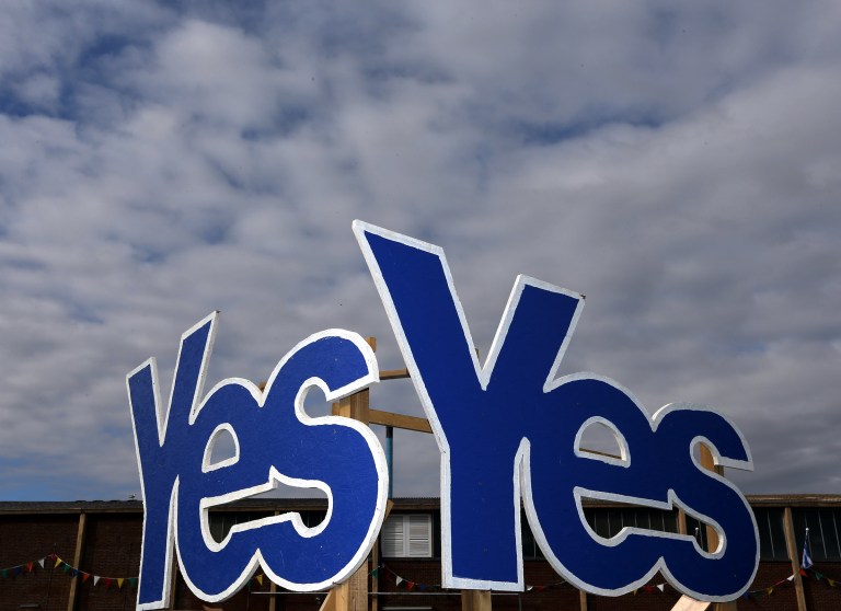 Yes Signs are displayed in Eyemouth, Scotland, Monday, Sept. 8, 2014. Polls predict a very close vote in the upcoming landmark referendum on Scottish independence from Britian on September 18. (AP Photo/Scott Heppell)