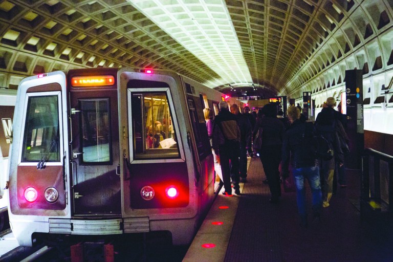 Graeme Jennings/Examiner File
Commuters board a train at Farragut North Metro station in October.