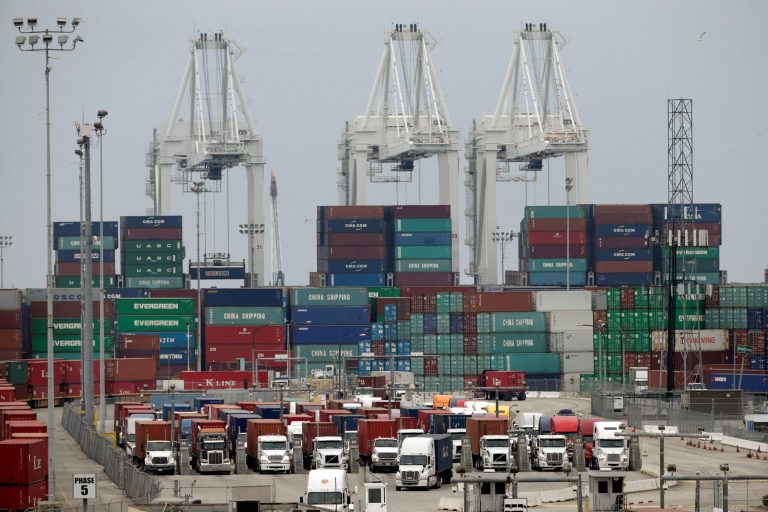 In this Tuesday, Feb. 17, 2015, file photo, cargo trucks wait in line at the Port of Long Beach, in Long Beach, Calif. (AP Photo/Jae C. Hong, File)