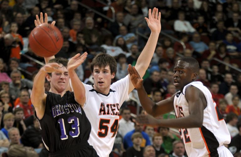 Ames' Yempabou Palo, right, and James Kohler defend against Johnston's Corey Schaefer in a Class 4A semifinal game at the Iowa boy's high school basketball tournament, Friday, March 13, 2009, in Des Moines, Iowa. (AP Photo)Â 
