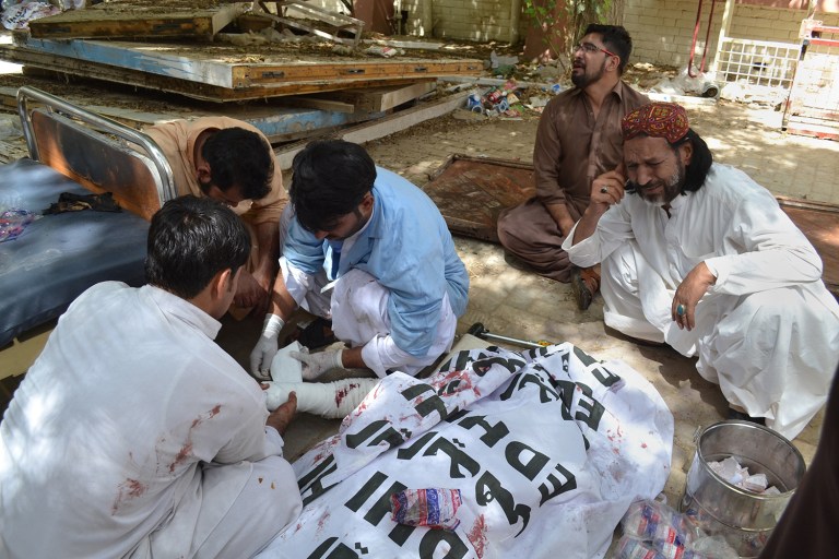 A terrorist attack Monday at a hospital in southwest Pakistan killed more than five dozen people and wounded at least 100 more. (AP Photo/Arshad Butt)