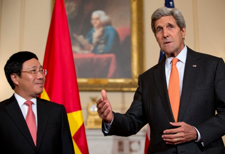 Secretary of State John Kerry, joined by Vietnamese Foreign Minister Pham Binh Minh, speaks to media at the State Department in Washington on Thursday. (AP/Carolyn Kaster)