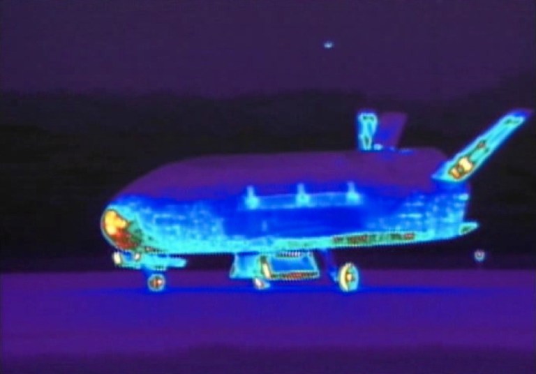   This Saturday, June 16, 2012 image from video made available by the Vandenberg Air Force Base shows an infrared view of the X-37B unmanned spacecraft landing at Vandenberg Air Force Base. The spacecraft, which was launched from Cape Canaveral Air Force Station in Florida in March 2011, conducted in-orbit experiments during the 15-month clandestine mission, officials said. It was the second such autonomous landing at the base. (AP Photo/Vandenberg Air Force Base)  