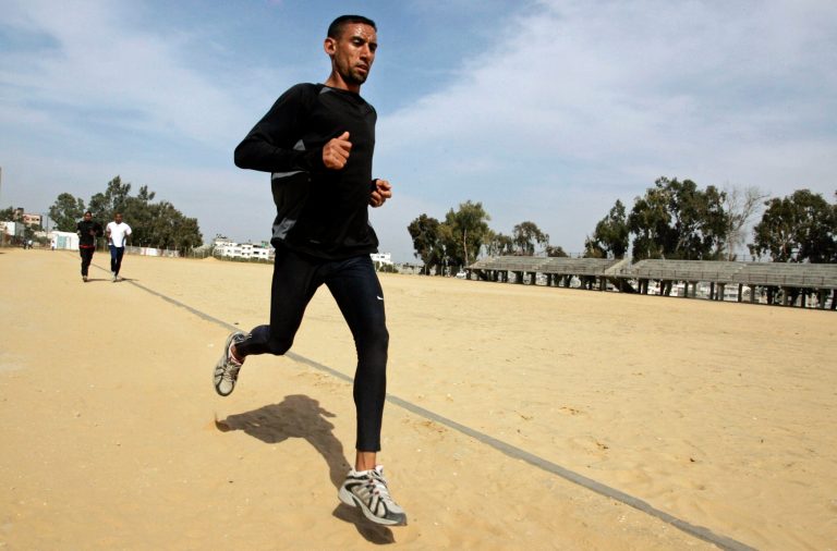 FILE - In this Saturday, April 5, 2008 file photo, Nader Masri exercises in Gaza City. On Tuesday, April 8, 2014 Israel's high court has upheld a decision by the military to prevent Nader Masri, 34, a Gaza Olympian, from leaving the coastal strip to participate in a marathon in the West Bank. Israel has severely restricted the movement of people and goods in and out of Gaza since the Islamic militant Hamas took control there in 2007. Tuesday's ruling ends hopes of 34-year-old Nader Masri to participate in Friday's marathon in biblical Bethlehem. (AP Photo/Hatem Moussa/File)