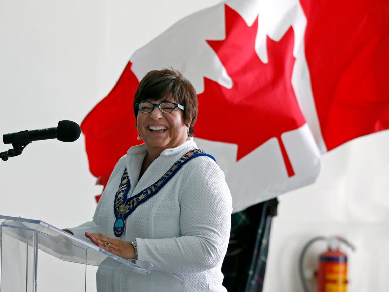 Pam Mood, Mayor of Yarmouth, Nova Scotia, laughs while speaking aboard the Nova Star cruise ferry during a ceremony in Boston, Monday, May 12, 2014. The Nova Star, a 528-foot cruise ferry that can carry more than 1200 passengers and 300 motor vehicles, will make daily roundtrip crossings between Yarmouth, Nova Scotia and Portsmouth, Maine. (AP Photo/Elise Amendola)