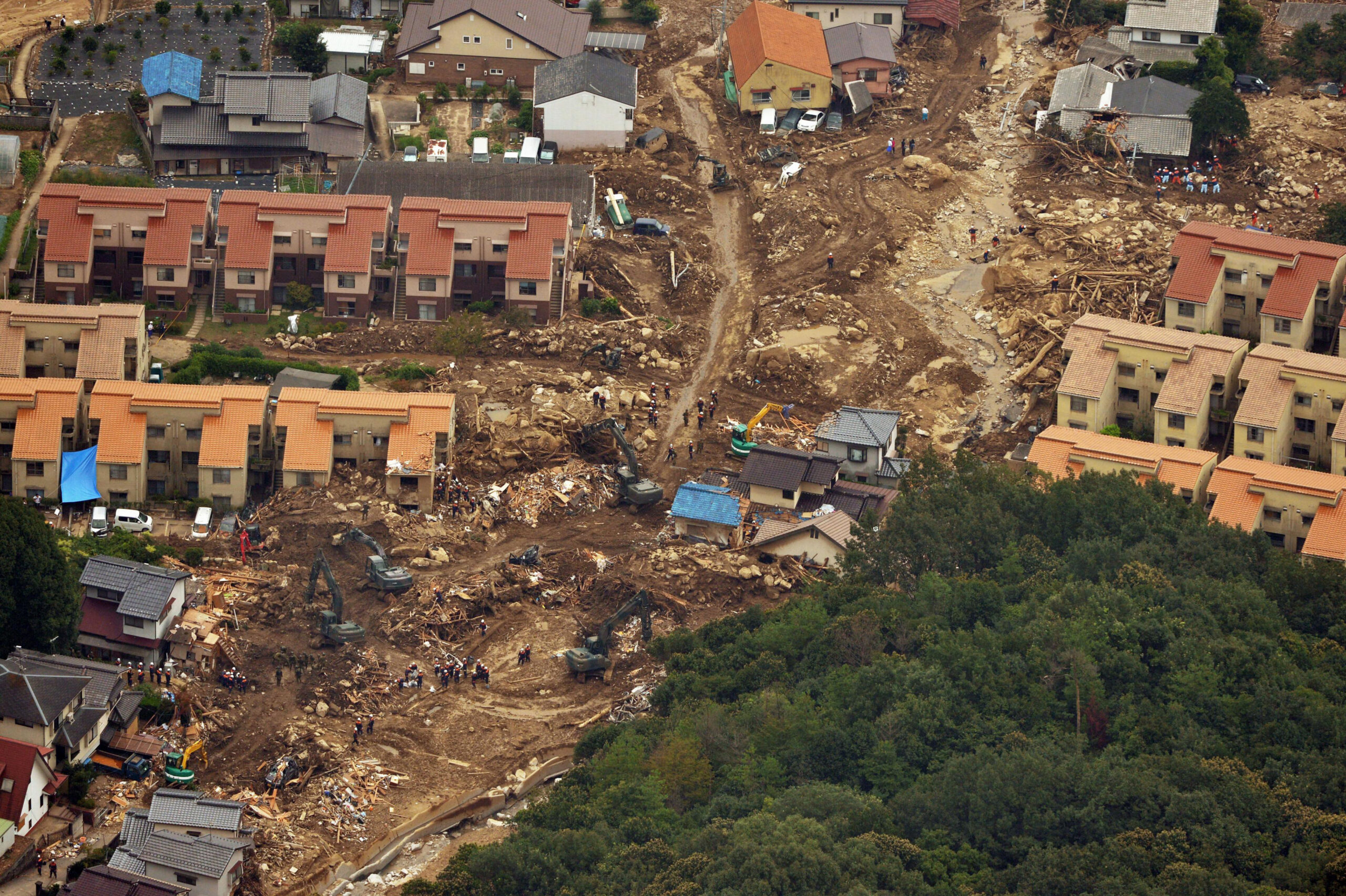Japan PM visits landslide site as complaints swirl