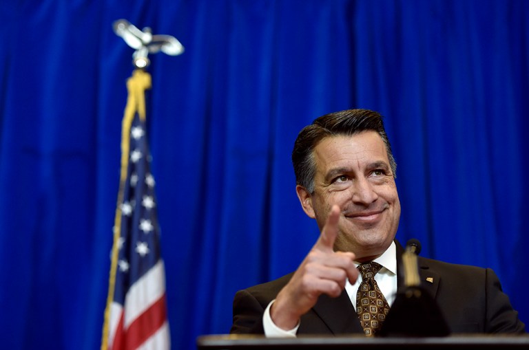 Nevada Gov. Brian Sandoval speaks at a news conference, Thursday, Dec. 10, 2015, in Las Vegas. Sandoval announced plans for Faraday Future, a Chinese-backed electric carmaker's $1 billion manufacturing plant to be built in North Las Vegas, Nev. (AP Photo/David Becker)