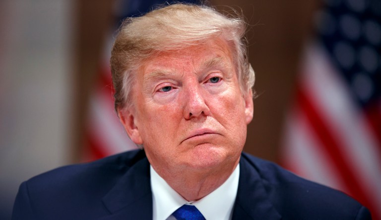 The federal lawsuit charges that the loss in federal funding jeopardizes programs that provide more than 800,000 low-income people with access to healthcare. (AP Photo/Evan Vucci)