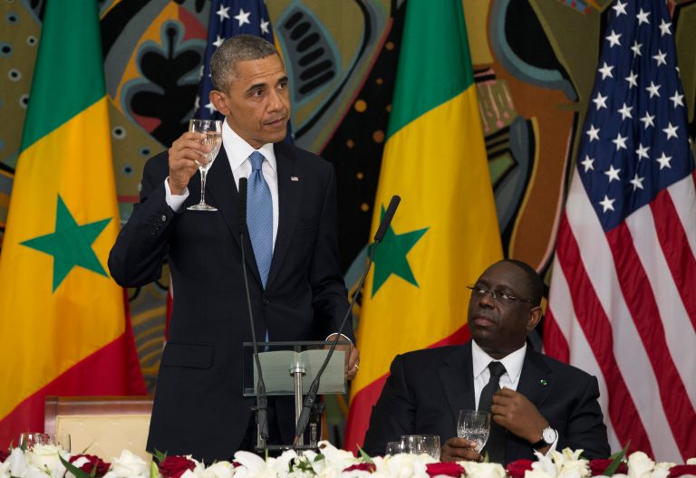President Obama, makes a toast during an official dinner with Senegalese President Macky Sall at the Presidential Palace on Thursday, in Dakar. Obama is visiting Senegal, South Africa, and Tanzania on a week long trip. (AP Photo/Evan Vucci)