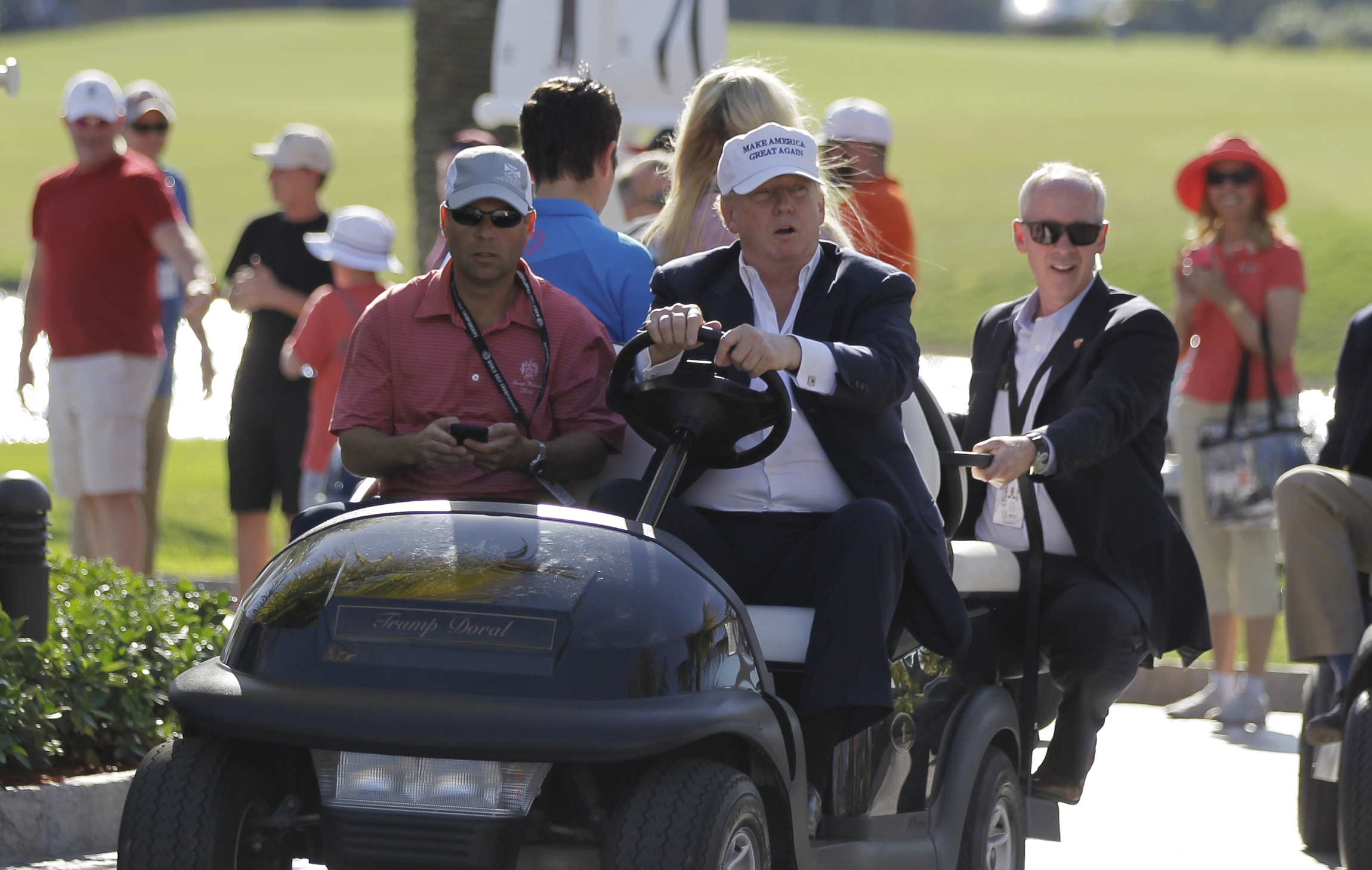 Trump visits golf course after tweeting Obama wiretap accusations