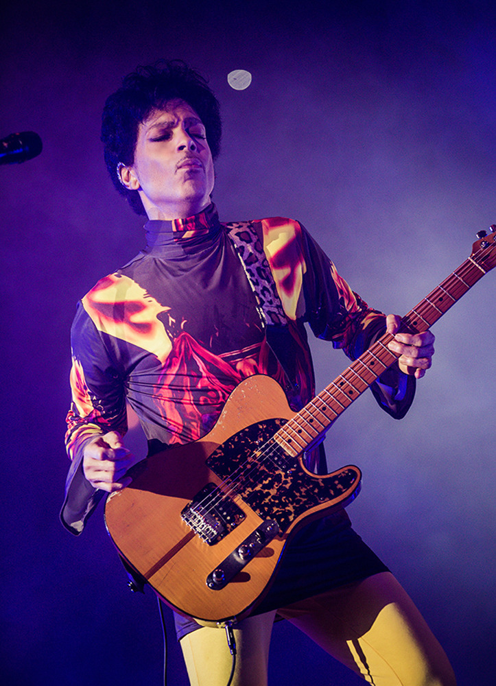 This Fall 2012 publicity photo provided by Rogers and Cowan shows musician Prince performing in concert in Chicago. Prince turns off the lights at South by Southwest on Saturday, March 16, 2013, with an unexpected and intimate showcase that ranks among the biggest surprises in years at the star-studded music festival and conference. (AP Photo/Rogers and Cowan)