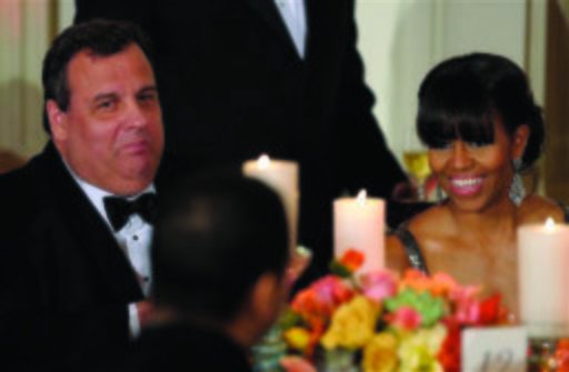 First lady Michelle Obama, sitting at Sunday night's Governor's Dinner with New Jersey Gov. Chris Christie, later via video presented Argo with the best picture Oscar. AP Photo