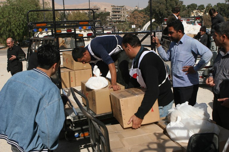 The United Nations is halting aid to Syria after its deadly attack in Aleppo against a convoy of aid trucks and a warehouse containing essential supplies. (AP Photo Bassem Tellawi)