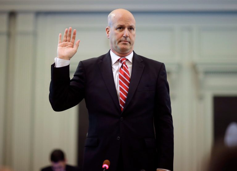 Michael Drewniak, chief spokesman for Gov. Chris Christie, is sworn in Tuesday, May 13, 2014, before the state legislature's Select Committee on Investigation in Trenton, N.J. The committee is probing the politically motivated closure of access lanes to the George Washington Bridge in Fort Lee last September. (AP Photo/Mel Evans)