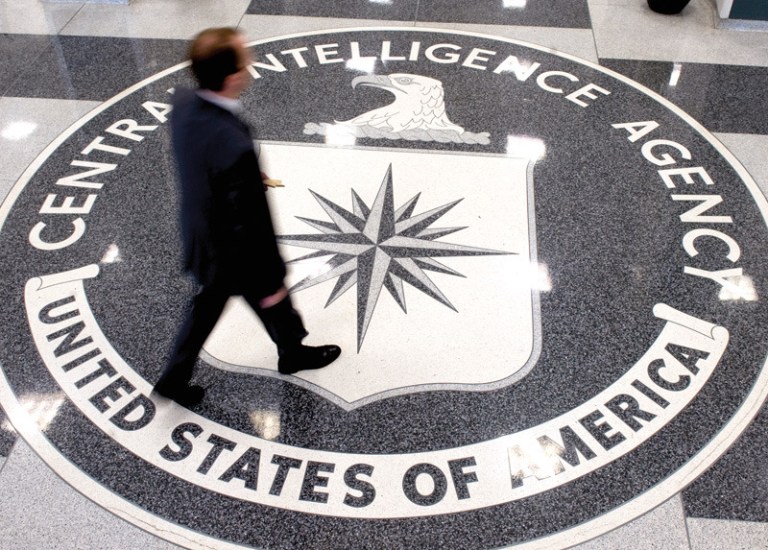 A man crosses the Central Intelligence Agency logo in the lobby of CIA Headquarters in Langley, Va. (SAUL LOEB/AFP/Getty Images)