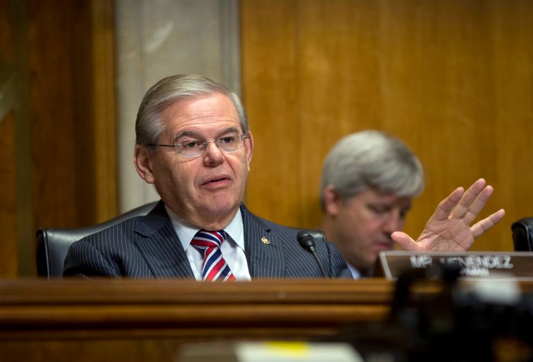 FILE - In this Jan. 9, 2014, file photo, Senate Foreign Relations Committee Chairman Sen. Robert Menendez, D-N.J., asks questions at a hearing on Capitol Hill in Washington, Thursday, Jan. 9, 2014. Menendez paid a law firm $250,000 in December 2013 for legal costs related to Justice Department and Senate Ethics Committee investigations into his ties with a major campaign donor. The Democrat also has set up a legal trust to raise money as the investigations continue.