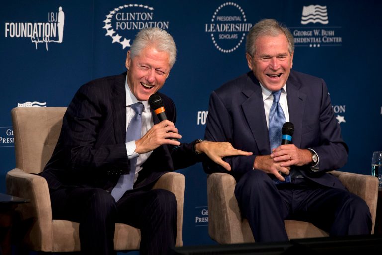 Former Presidents Bill Clinton, left, and George W. Bush, laugh while participating in the Presidential Leadership Scholars Program Launch, Monday, Sept. 8, 2014, at The Newseum in Washington. The two are launching a new scholars program at four presidential libraries, aiming to help academics and business leaders learn more about presidential leadership.  (AP Photo/Jacquelyn Martin)