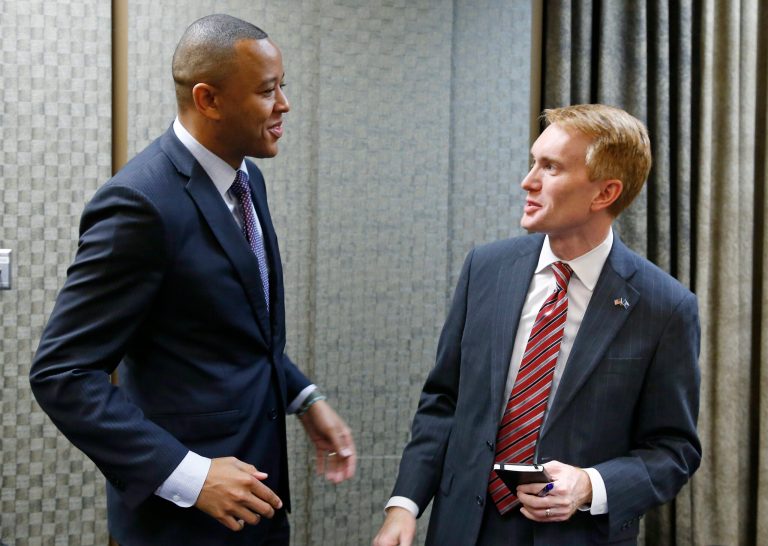 Oklahoma state Rep. T.W. Shannon, left, talks with U.S. Rep. James Lankford, right, following a Republican candidate forum for the open U.S. Senate seat in Lawton, Okla., in this Friday, June 6, 2014 photo. (AP Photo/Sue Ogrocki)